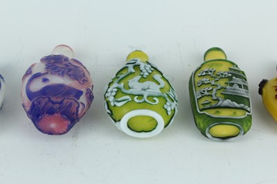 Lot 31 - A group of eight Chinese glass snuff bottles,...