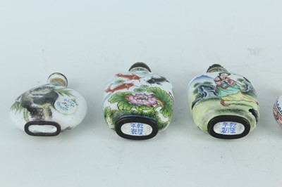 Lot 28 - A group of five Chinese painted enamel snuff...