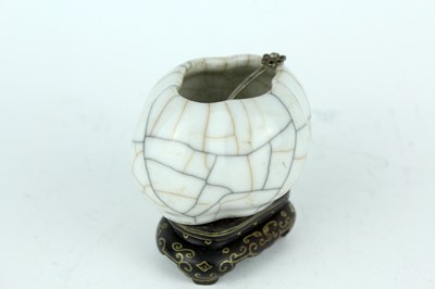 Lot 94 - A Chinese Ge-type water pot with a small ladle,...
