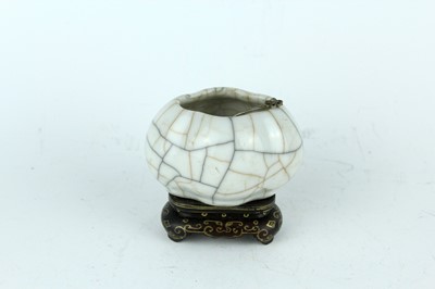 Lot 94 - A Chinese Ge-type water pot with a small ladle,...