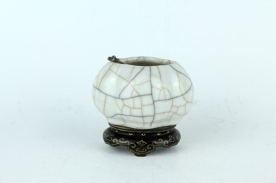 Lot 94 - A Chinese Ge-type water pot with a small ladle,...