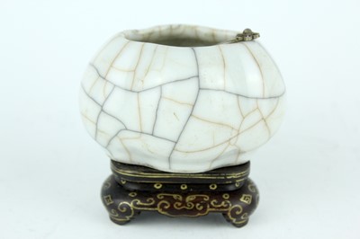 Lot 94 - A Chinese Ge-type water pot with a small ladle,...