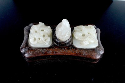 Lot 40 - A Chinese hardwood inlaid box with three jade...