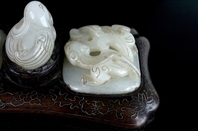 Lot 40 - A Chinese hardwood inlaid box with three jade...