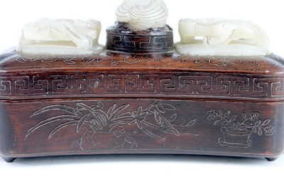 Lot 40 - A Chinese hardwood inlaid box with three jade...
