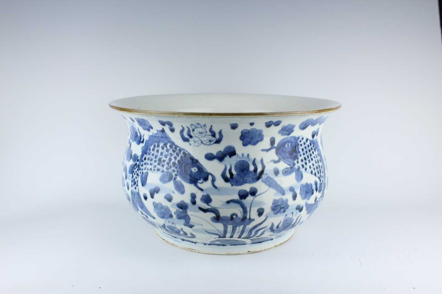 Lot 173 - A large Chinese blue and white fish bowl, 20th...