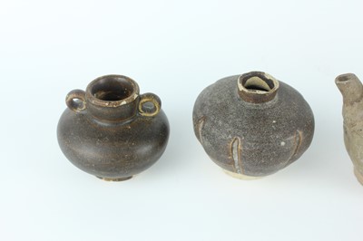Lot 121 - Five small Chinese black-glazed stoneware pots,...