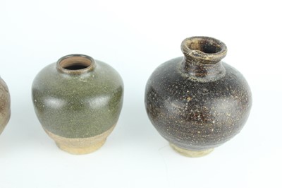 Lot 121 - Five small Chinese black-glazed stoneware pots,...