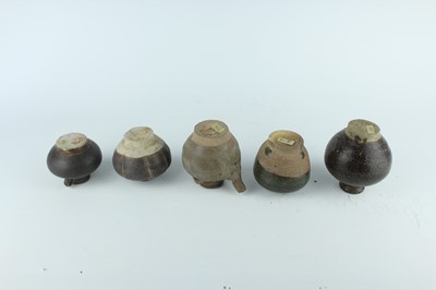 Lot 121 - Five small Chinese black-glazed stoneware pots,...