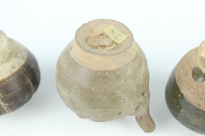 Lot 121 - Five small Chinese black-glazed stoneware pots,...