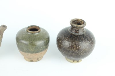 Lot 121 - Five small Chinese black-glazed stoneware pots,...