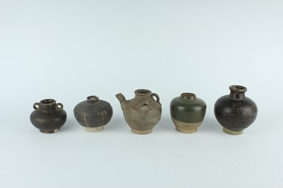 Lot 121 - Five small Chinese black-glazed stoneware pots,...
