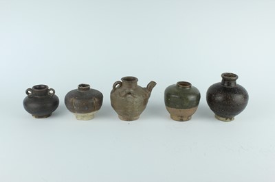 Lot 121 - Five small Chinese black-glazed stoneware pots,...