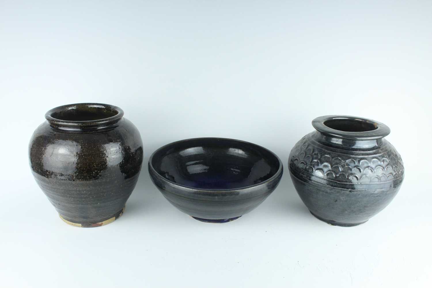 Lot 120 - Three Chinese dark blue to brown glazed...