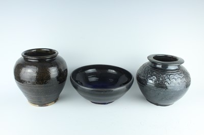 Lot 120 - Three Chinese dark blue to brown glazed...