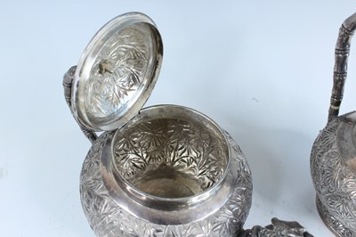 Lot 159 - A set of four Chinese export silver tea sets,...