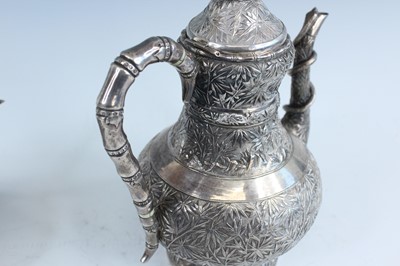 Lot 159 - A set of four Chinese export silver tea sets,...