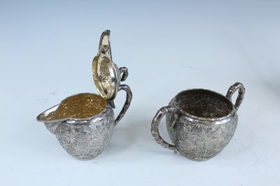 Lot 159 - A set of four Chinese export silver tea sets,...