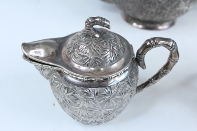 Lot 159 - A set of four Chinese export silver tea sets,...