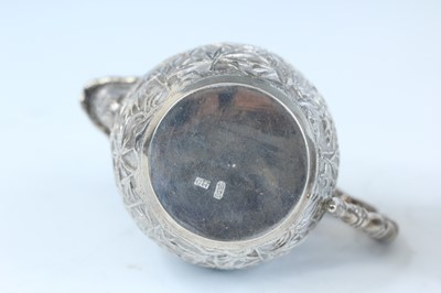 Lot 159 - A set of four Chinese export silver tea sets,...