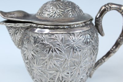 Lot 159 - A set of four Chinese export silver tea sets,...