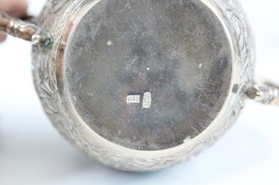 Lot 159 - A set of four Chinese export silver tea sets,...