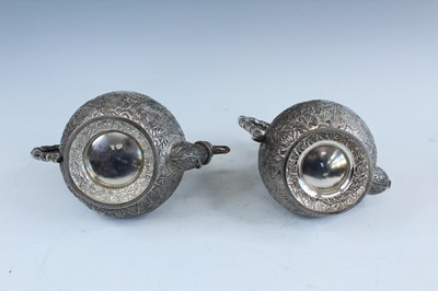 Lot 159 - A set of four Chinese export silver tea sets,...