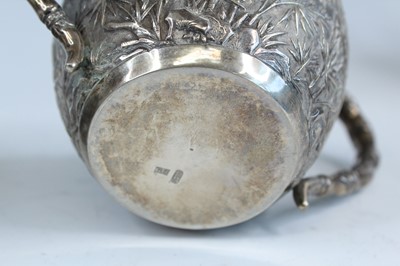 Lot 159 - A set of four Chinese export silver tea sets,...