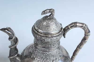 Lot 159 - A set of four Chinese export silver tea sets,...
