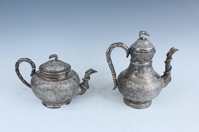 Lot 159 - A set of four Chinese export silver tea sets,...