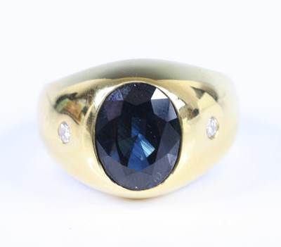 Lot 2776 - A gent's yellow metal, sapphire and diamond...