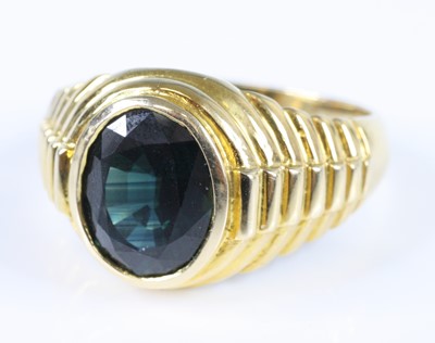 Lot 2777 - A gent's yellow metal sapphire set signet ring,...