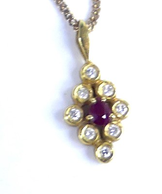 Lot 2798 - An 18ct gold, ruby and diamond lozenge pendant,...