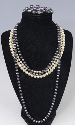 Lot 2800 - A freshwater grey pearl necklace, strung...