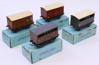 Lot 428 - Four Hornby Dublo vans all pre-war, to include...