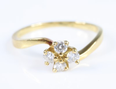 Lot 2803 - An 18ct yellow gold diamond crossover style...