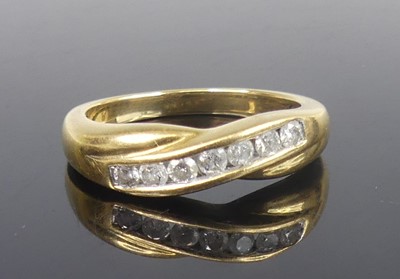 Lot 2793 - A yellow metal diamond half-hoop ring, the...