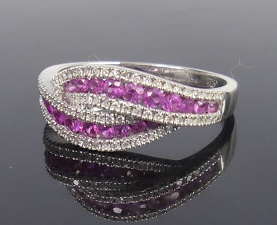 Lot 2794 - A modern 18ct white gold, ruby and diamond...