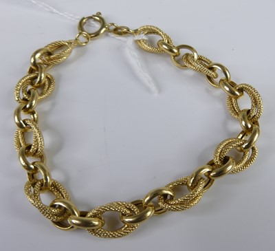 Lot 2814 - An 18ct gold bracelet, arranged as alternating...