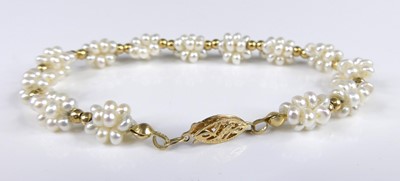 Lot 2815 - A 14ct yellow gold and seed pearl set bracelet,...