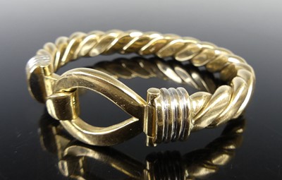 Lot 2832 - A modern 9ct gold heavy ropetwist bangle, with...