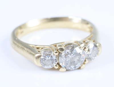 Lot 2828 - A yellow metal diamond three-stone ring,...