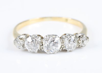 Lot 2836 - A white metal diamond five-stone ring,...