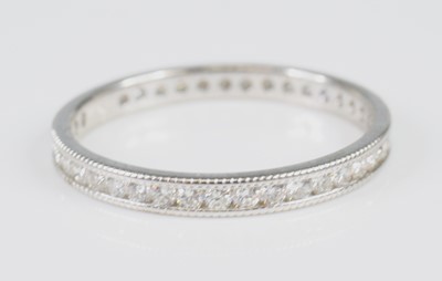 Lot 2840 - A white metal diamond eternity ring, featuring...