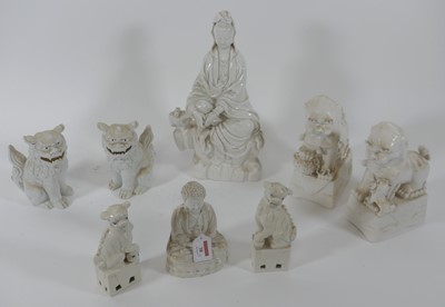 Lot 38 - A blanc-de-chine figure of Guanyin, in typical...