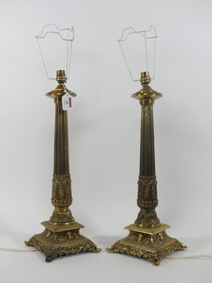 Lot 14 - A pair of brass column table lamps, in the...