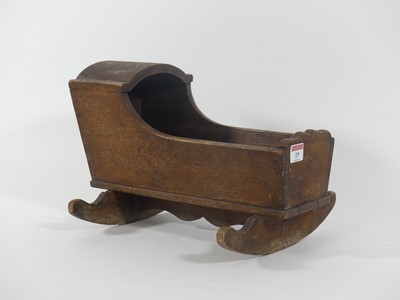 Lot 19 - A 19th century hardwood doll's crib, length 36cm