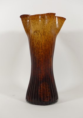 Lot 22 - A mottled brown art glass vase, having a wavy...