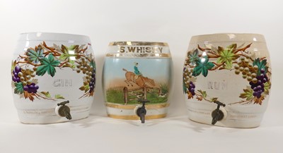 Lot 23 - A pair of pottery spirit barrels, inscribed...