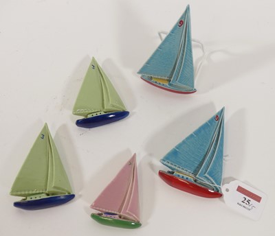 Lot 25 - A pair of Wade pottery models of sailing...